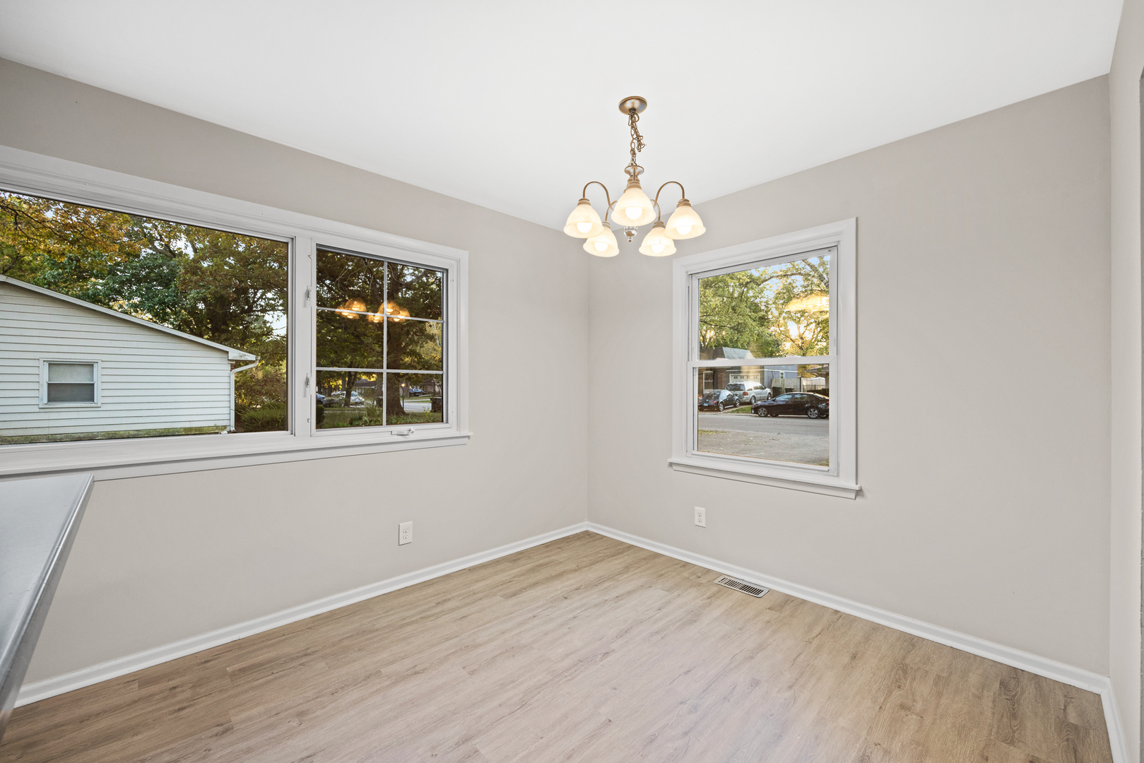 59 Briarcliff Road Montgomery, IL 60538 - Photo 8 of 34 a view of an empty room with wooden floor and a window