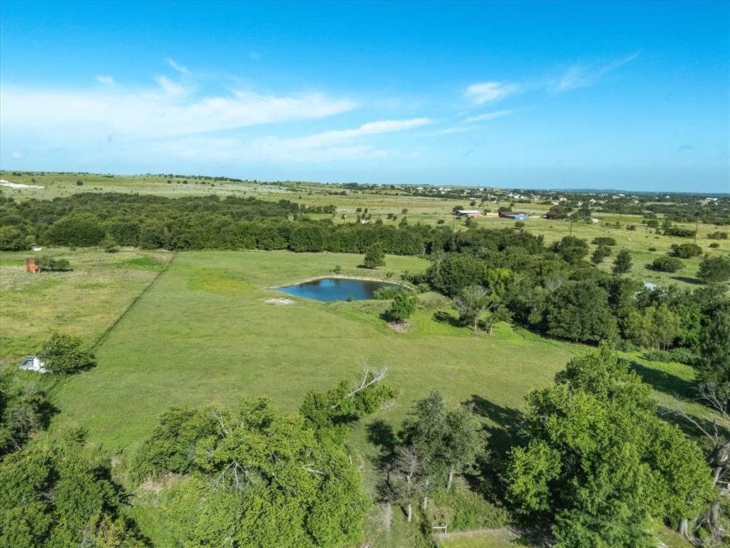 2690 Kelly Road Aledo, TX 76008 - Photo 14 of 19 Aerial view of property and surrounding area with a nearby body of water and rural landscape