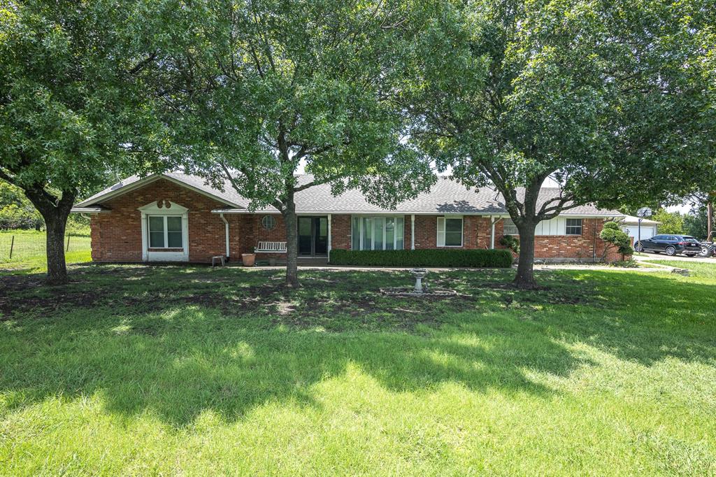 2690 Kelly Road Aledo, TX 76008 - Photo 2 of 19 Single story home with brick siding and a front yard