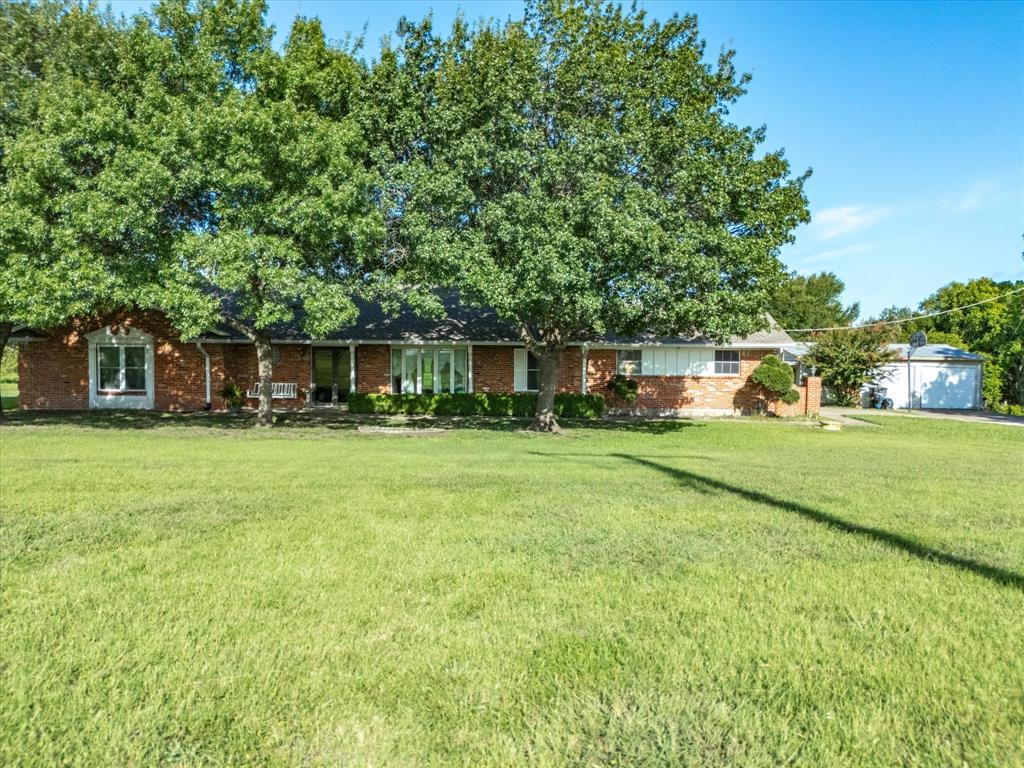 2690 Kelly Road Aledo, TX 76008 - Photo 4 of 19 Ranch-style house with a front lawn, brick siding, and a garage