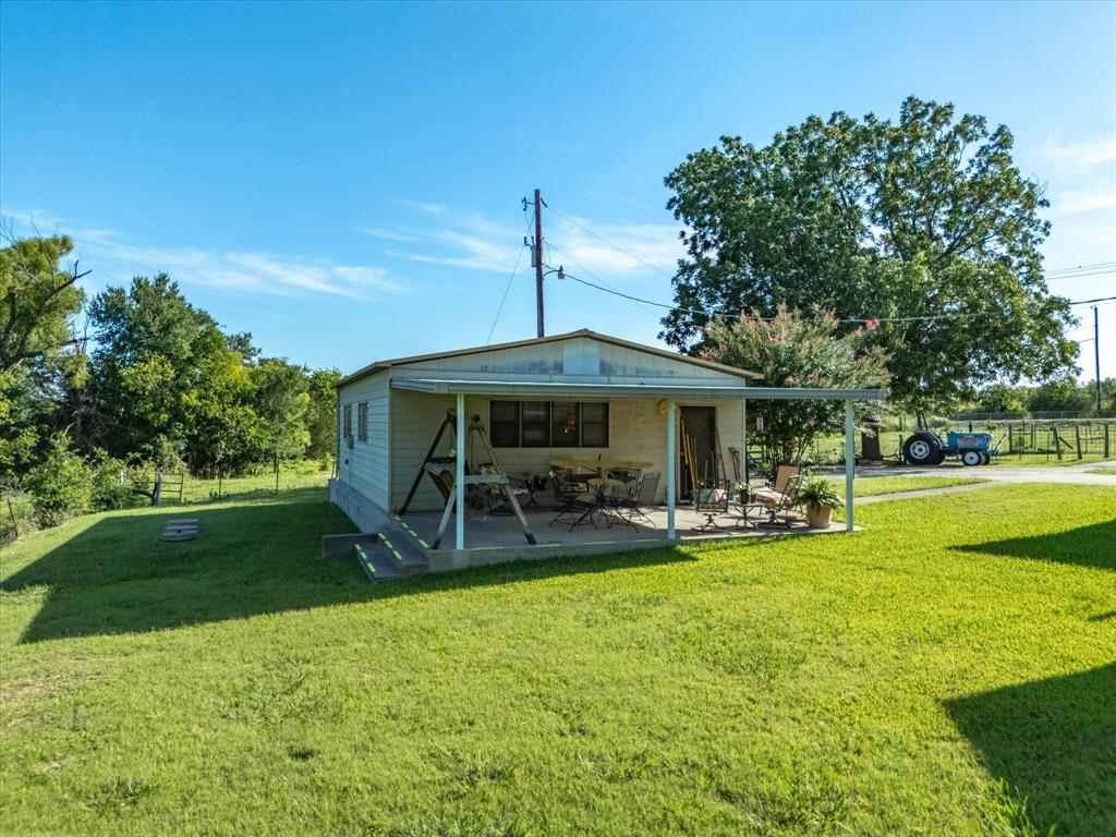 2690 Kelly Road Aledo, TX 76008 - Photo 8 of 19 Rear view of house with a patio area