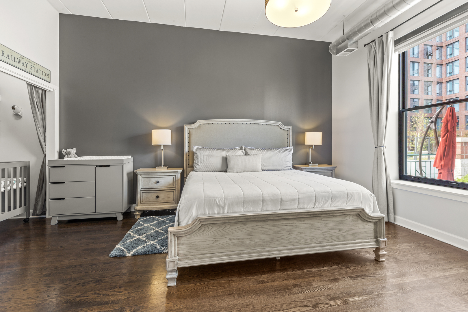 936 West Madison Street, Unit E4 Chicago, IL 60607 - Photo 12 of 21 a bedroom with a bed and window