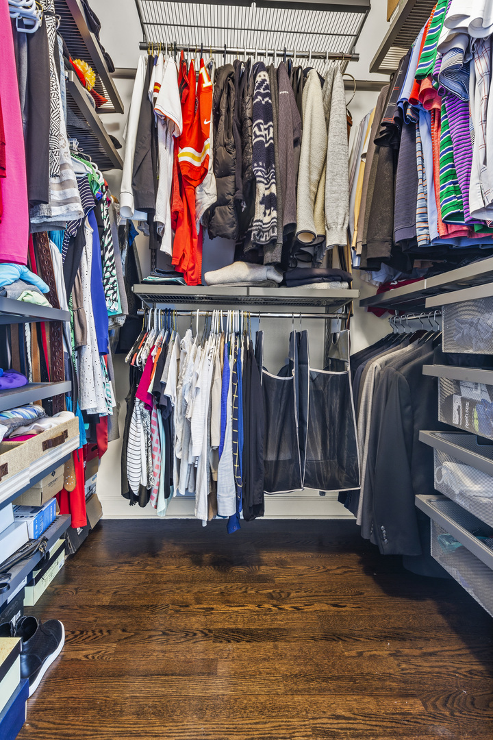 936 West Madison Street, Unit E4 Chicago, IL 60607 - Photo 15 of 21 a view of walk in closet with clothes