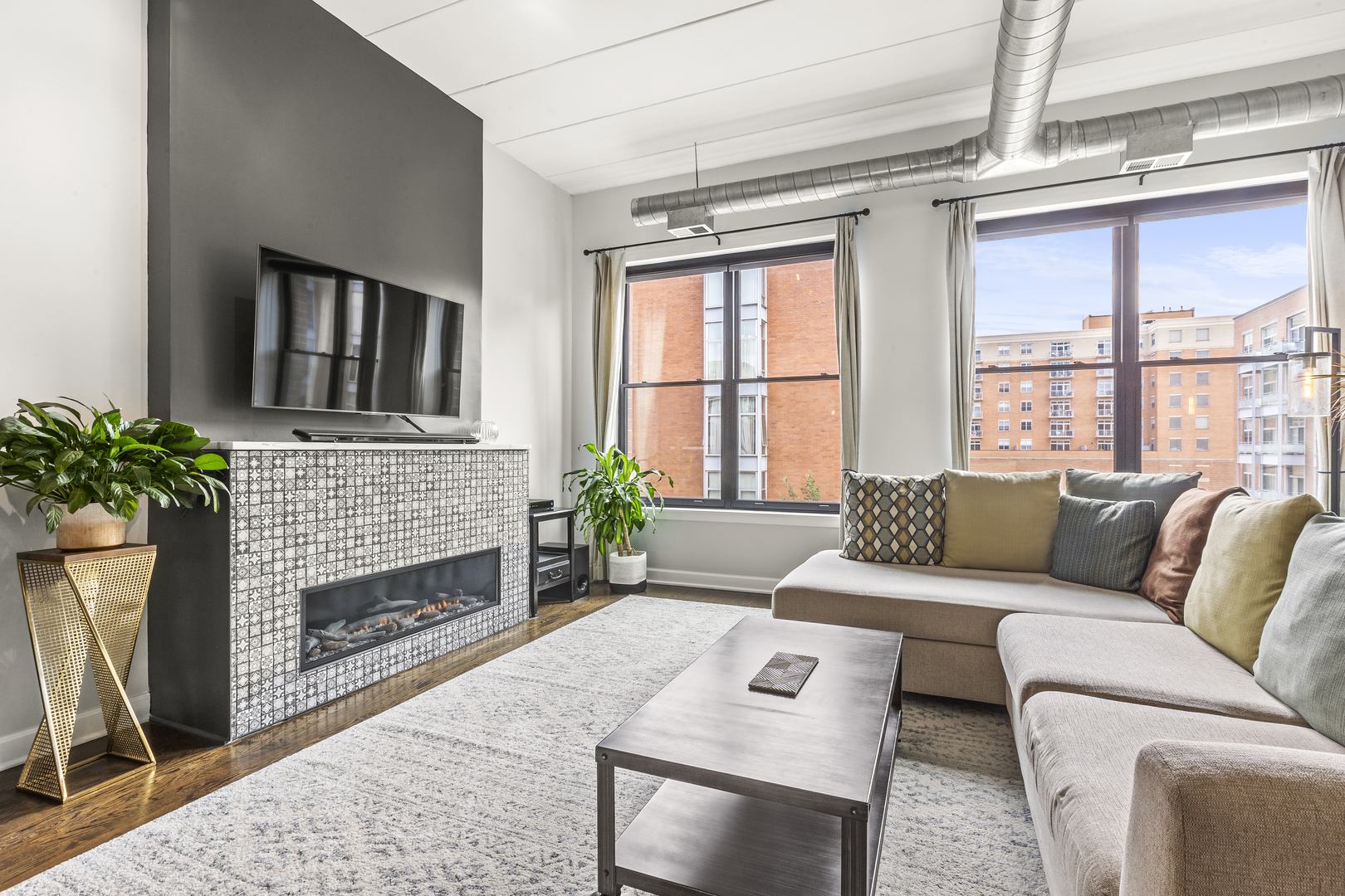 936 West Madison Street, Unit E4 Chicago, IL 60607 - Photo 2 of 21 a living room with furniture a window and a fireplace