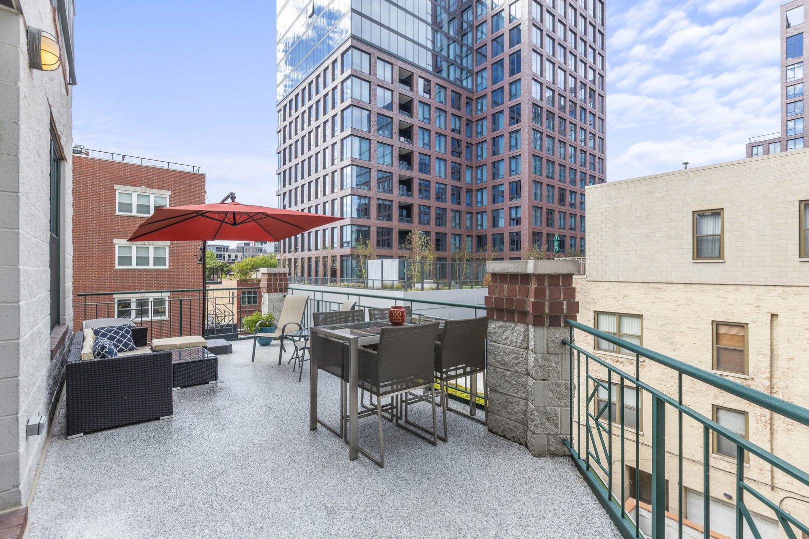 936 West Madison Street, Unit E4 Chicago, IL 60607 - Photo 21 of 21 a balcony with furniture and a potted plant