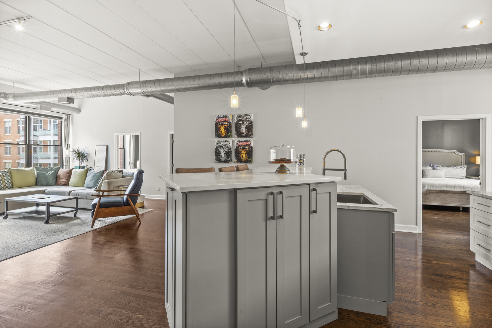 936 West Madison Street, Unit E4 Chicago, IL 60607 - Photo 7 of 21 a hallway with view of kitchen with dining table and chairs