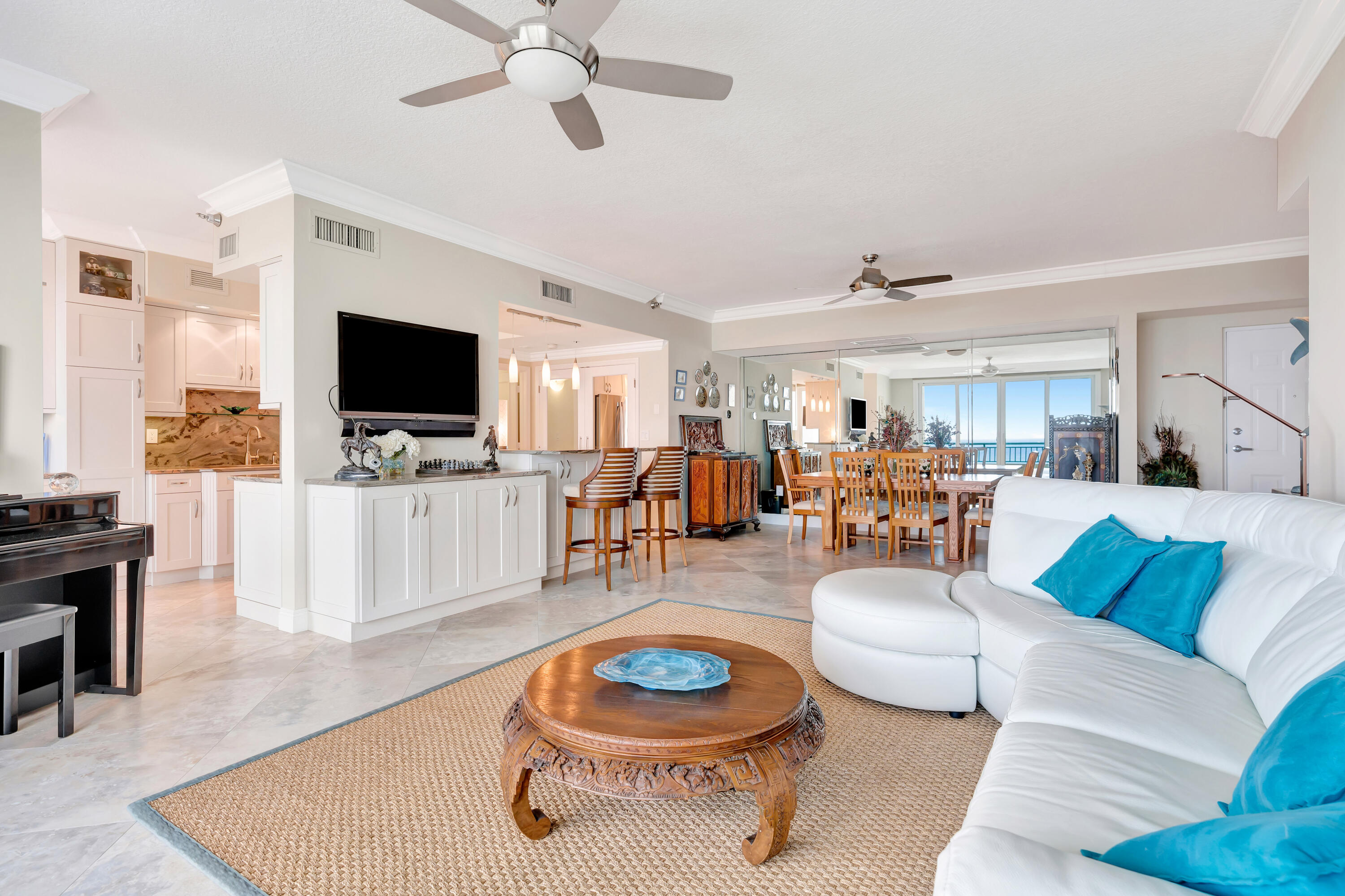 2000 Florida A1A, Unit N507 Jupiter, FL 33477 - Photo 16 of 78 a living room with furniture and a flat screen tv