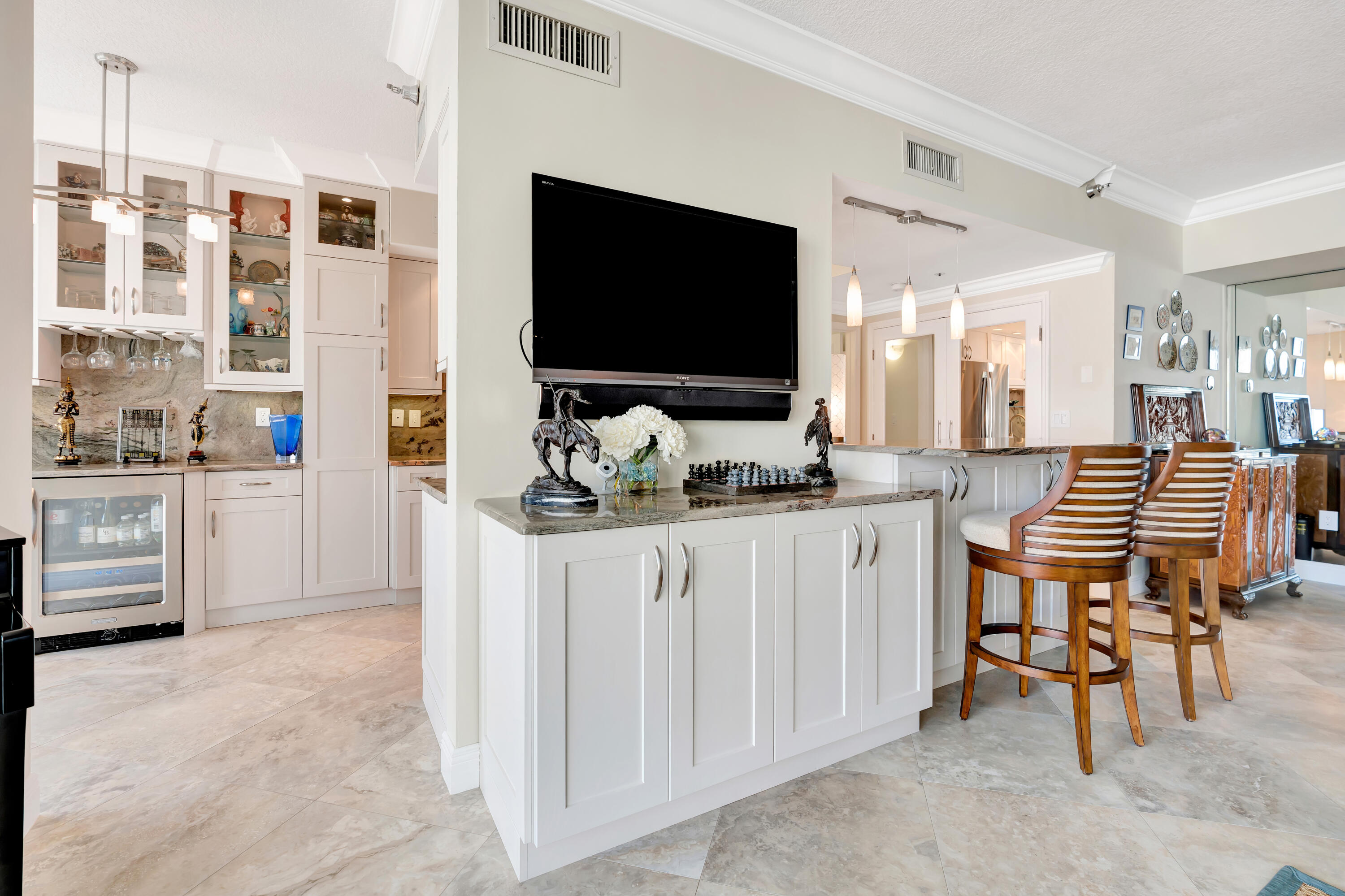 2000 Florida A1A, Unit N507 Jupiter, FL 33477 - Photo 21 of 78 a living room with furniture and a flat screen tv