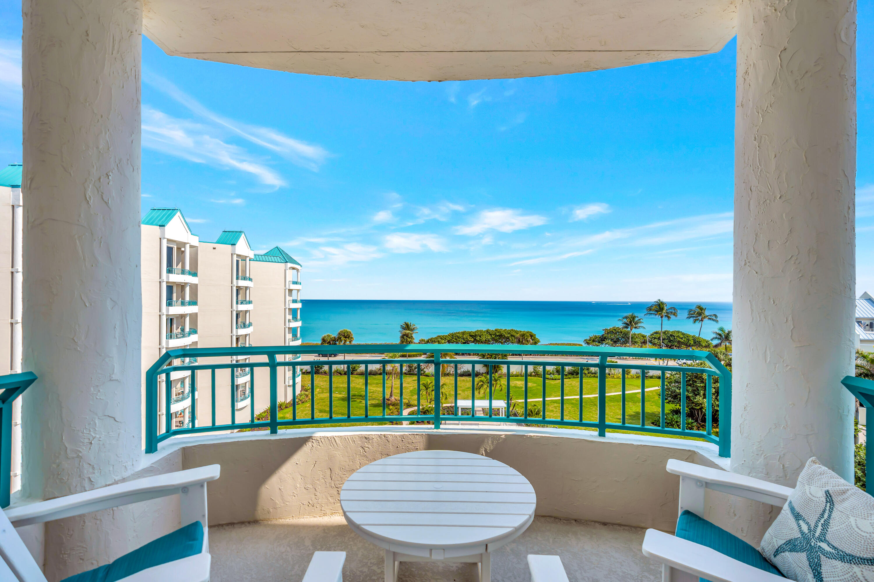 2000 Florida A1A, Unit N507 Jupiter, FL 33477 - Photo 36 of 78 a view of a swimming pool with a chairs