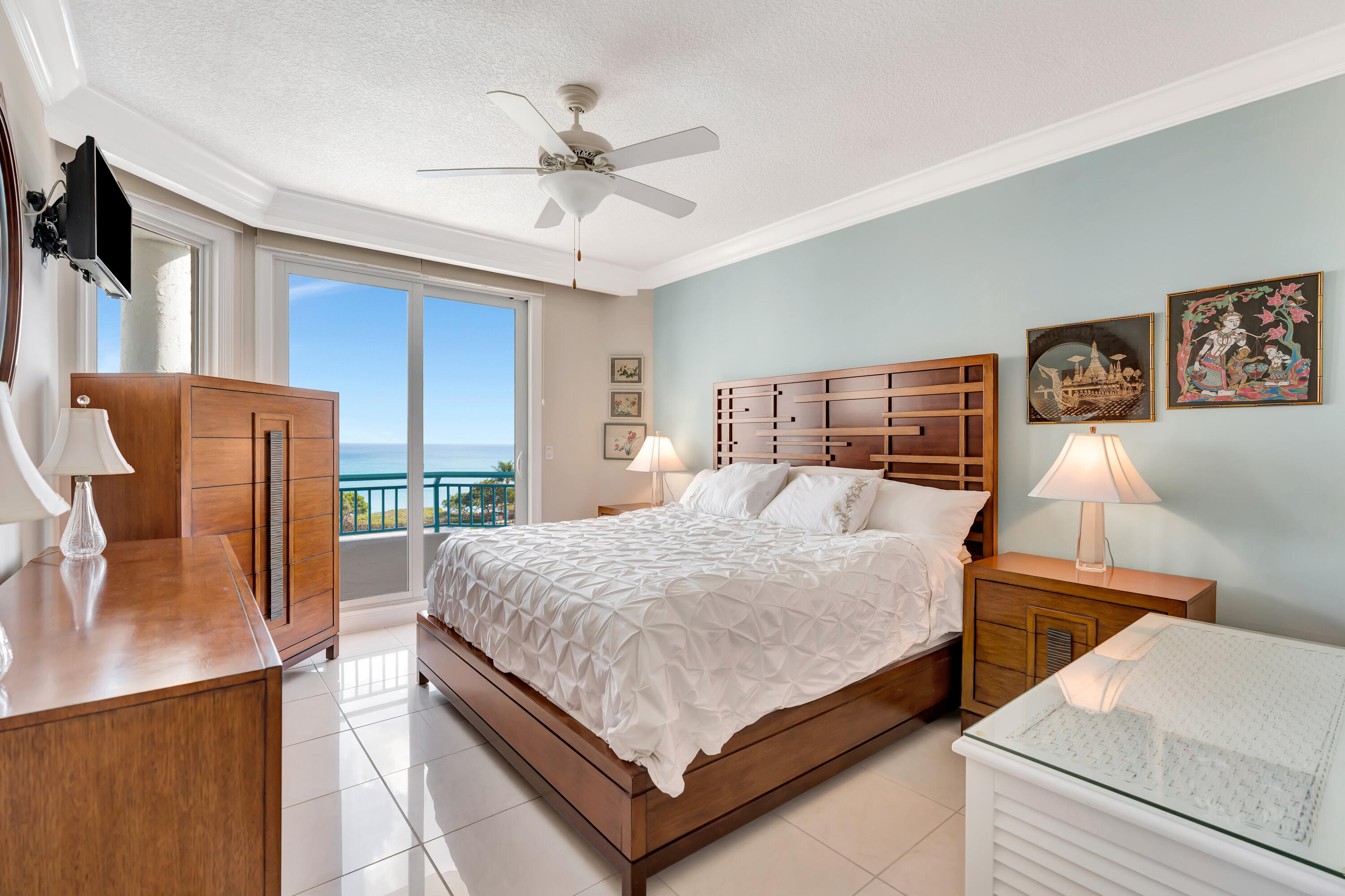 2000 Florida A1A, Unit N507 Jupiter, FL 33477 - Photo 38 of 78 a bed room with a bed window and a flat screen tv