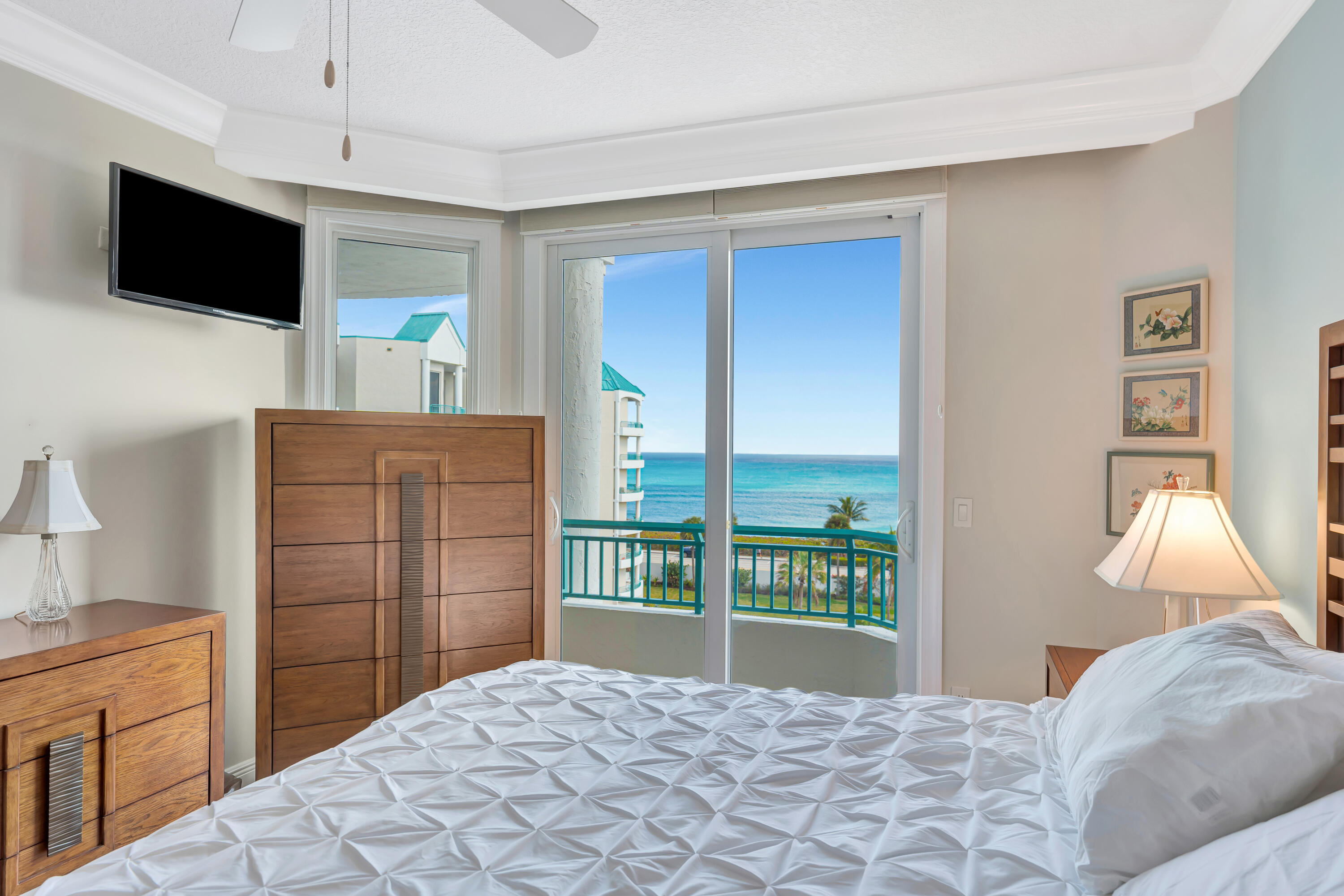 2000 Florida A1A, Unit N507 Jupiter, FL 33477 - Photo 40 of 78 a bedroom with a bed and a television