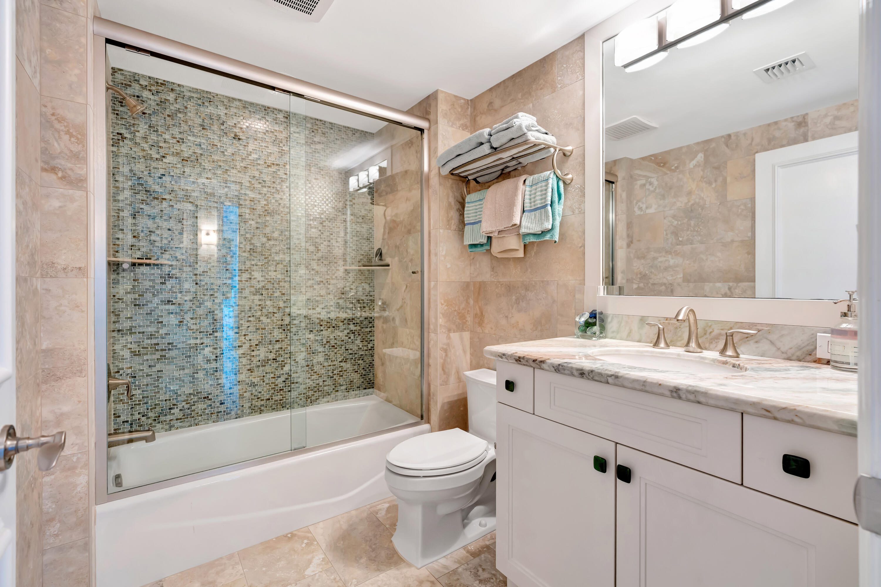 2000 Florida A1A, Unit N507 Jupiter, FL 33477 - Photo 53 of 78 a bathroom with a granite countertop sink toilet and shower