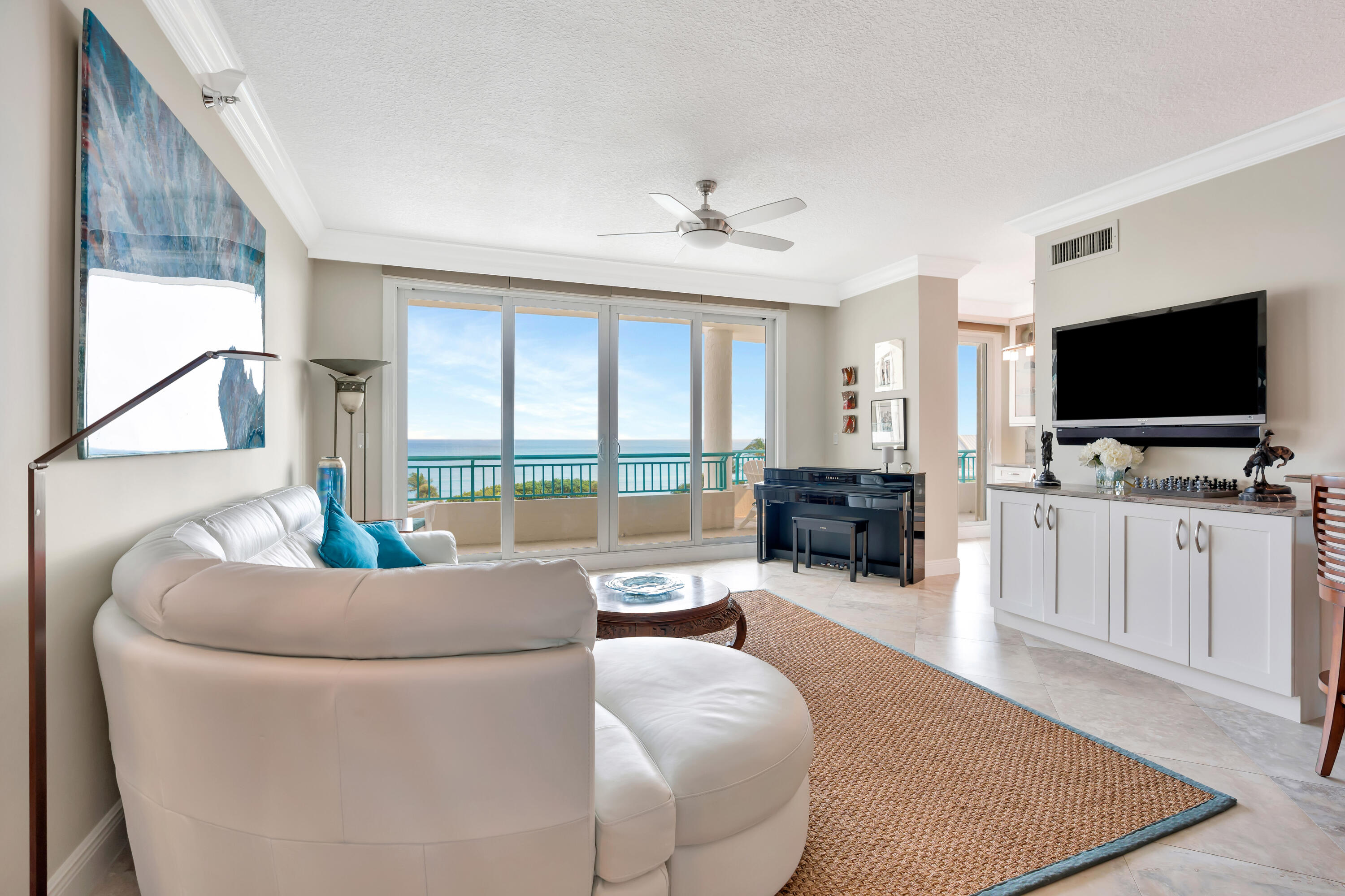 2000 Florida A1A, Unit N507 Jupiter, FL 33477 - Photo 6 of 78 a living room with furniture and a flat screen tv