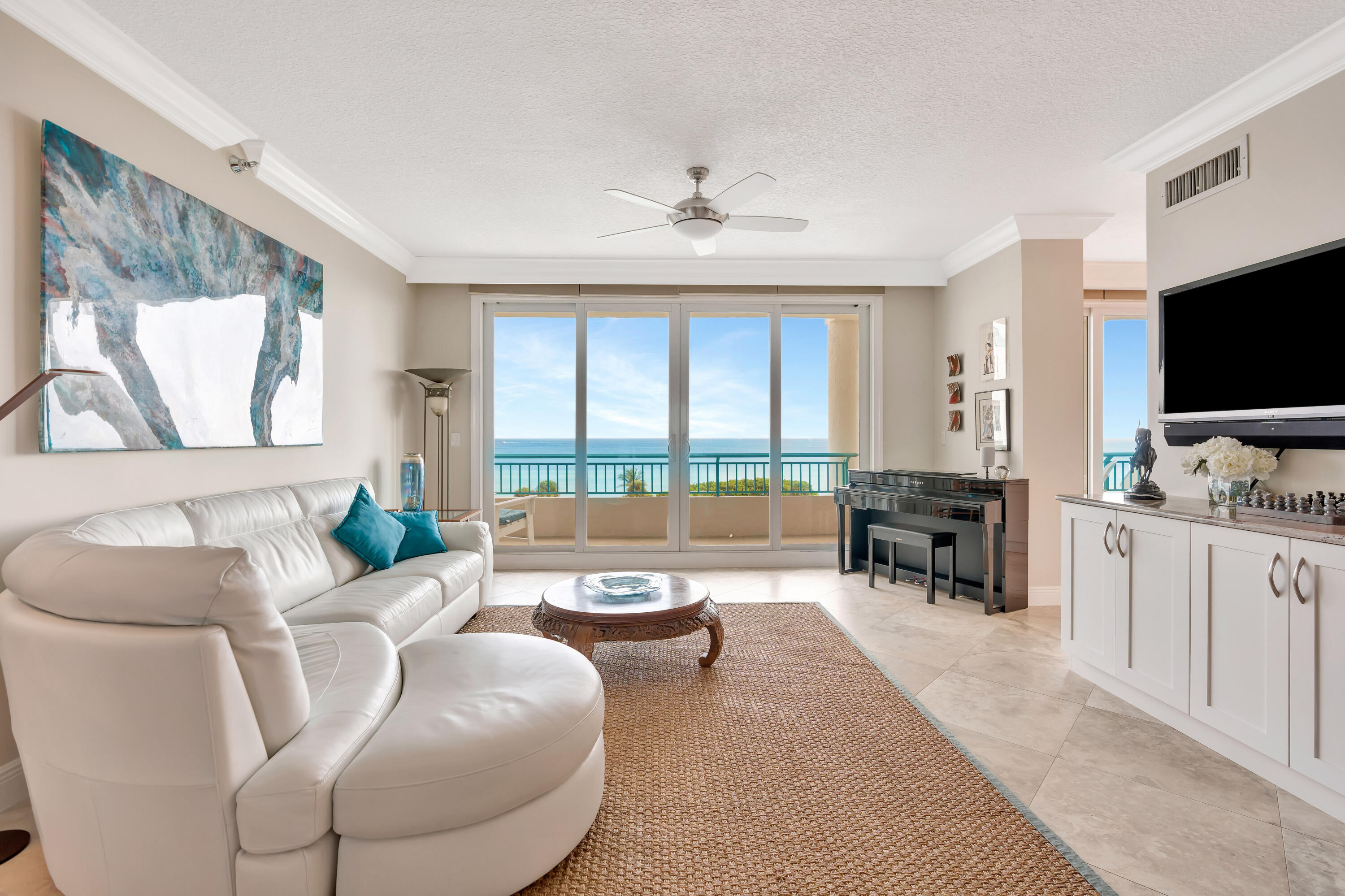 2000 Florida A1A, Unit N507 Jupiter, FL 33477 - Photo 7 of 78 a living room with furniture and a flat screen tv