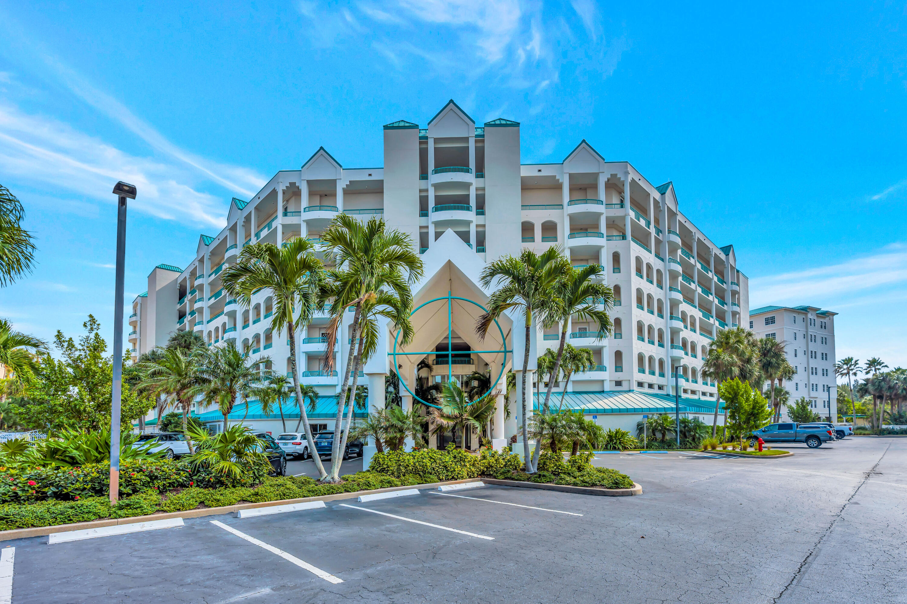 2000 Florida A1A, Unit N507 Jupiter, FL 33477 - Photo 72 of 78 a front view of multi story residential apartment building with yard and sign board