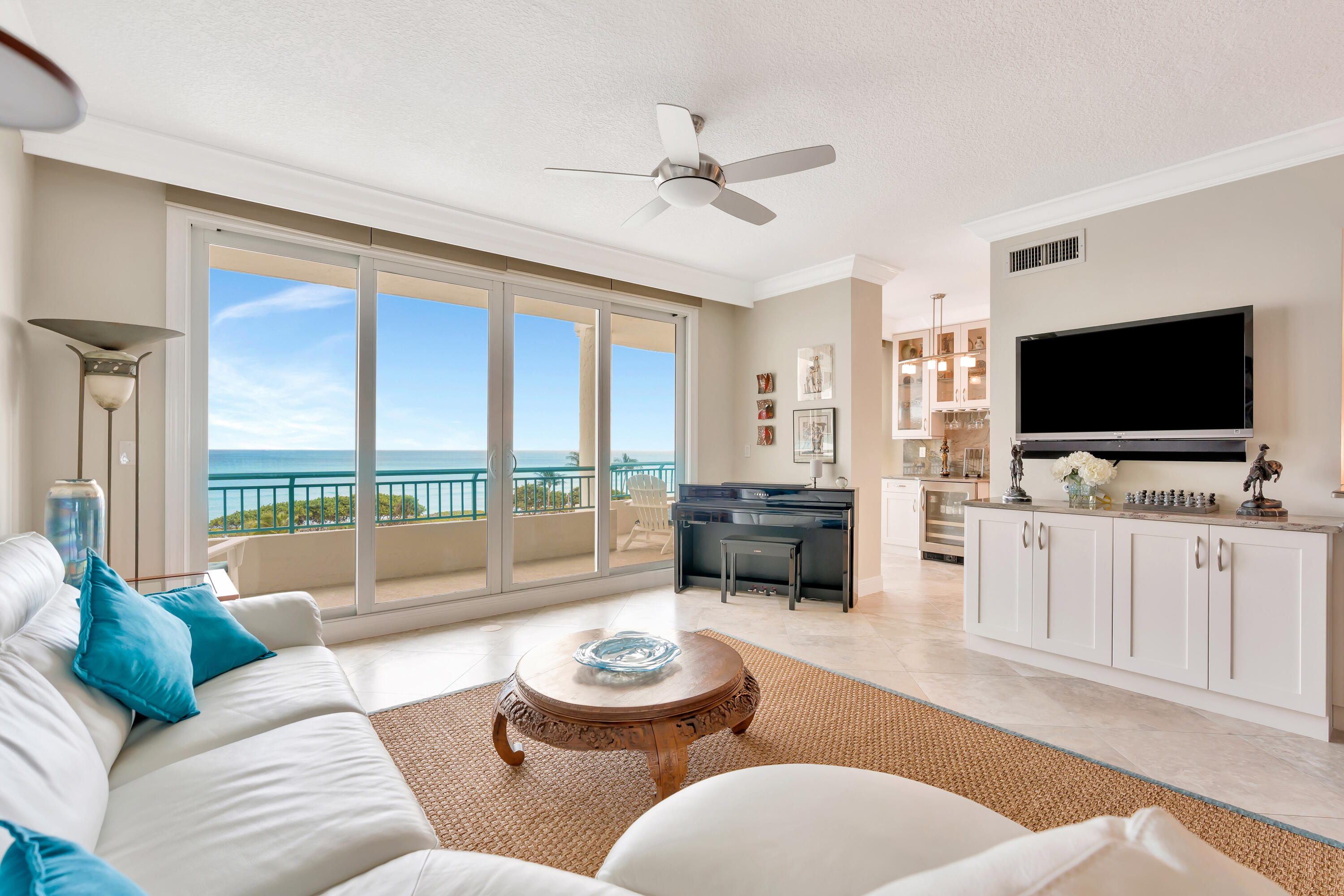 2000 Florida A1A, Unit N507 Jupiter, FL 33477 - Photo 8 of 78 a living room with furniture and a flat screen tv