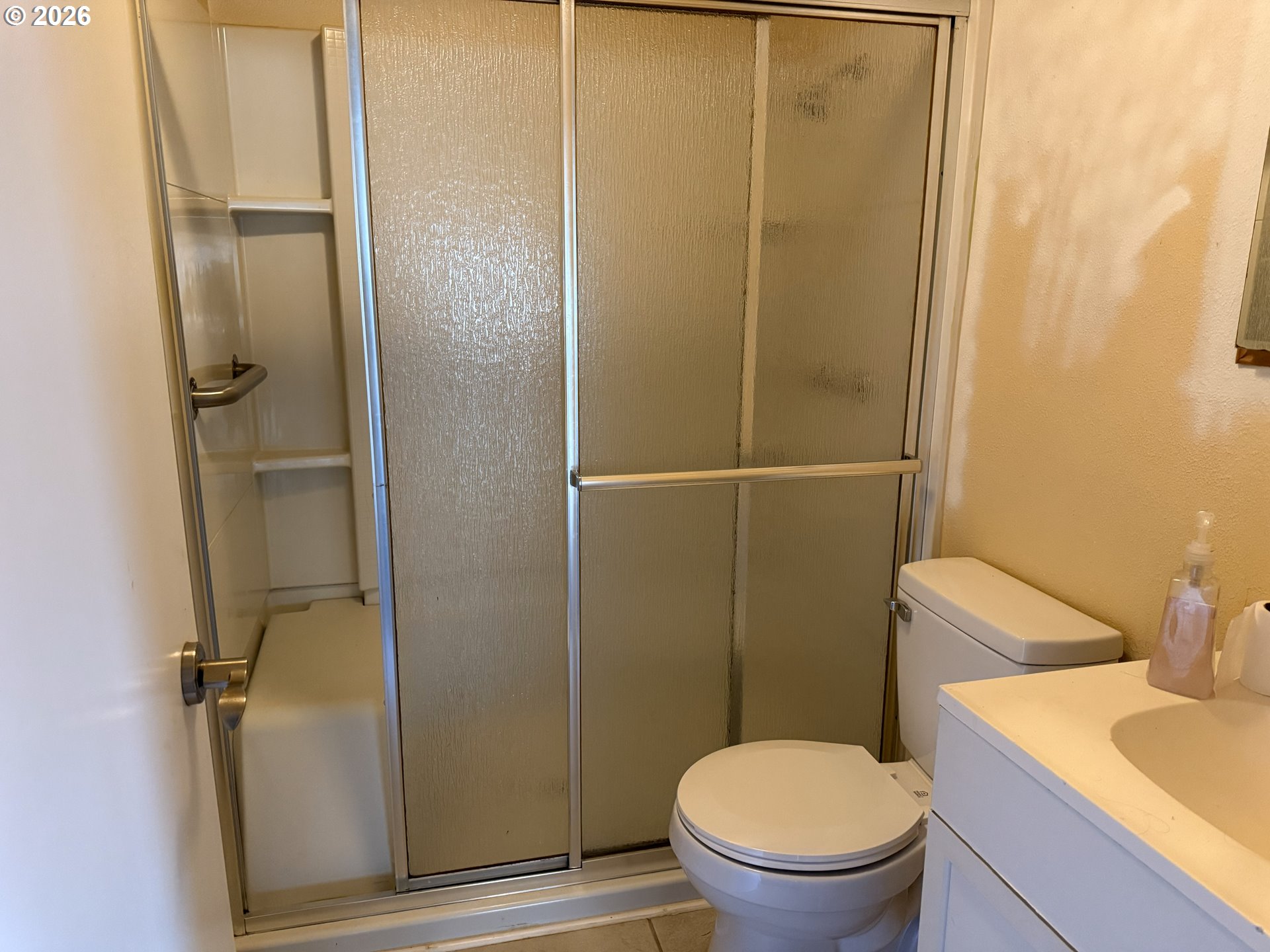 7451 Southeast Johnson Street Hillsboro, OR 97123 - Photo 16 of 27 a bathroom with a toilet and a sink