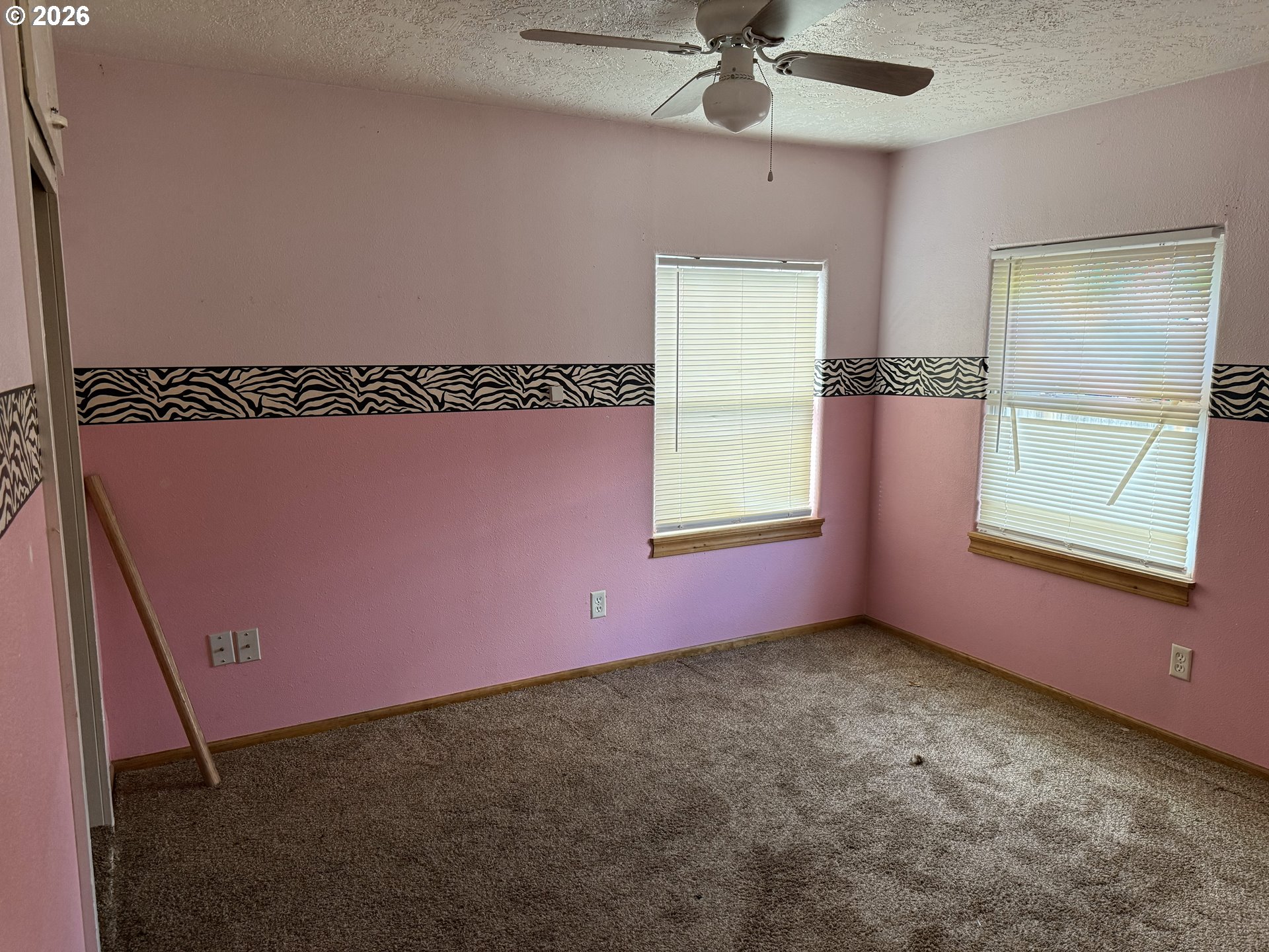 7451 Southeast Johnson Street Hillsboro, OR 97123 - Photo 18 of 27 an empty room with windows