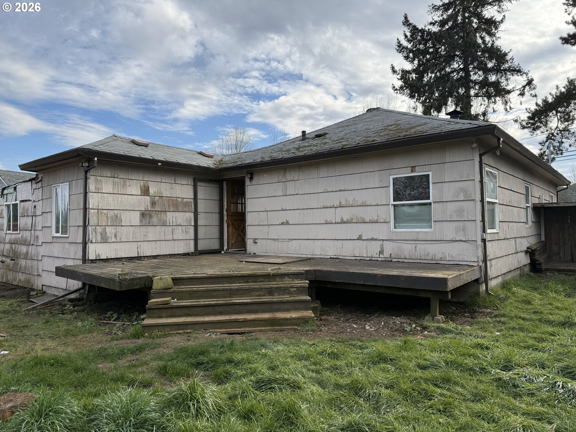 7451 Southeast Johnson Street Hillsboro, OR 97123 - Photo 19 of 27 a view of a house with a backyard and a patio