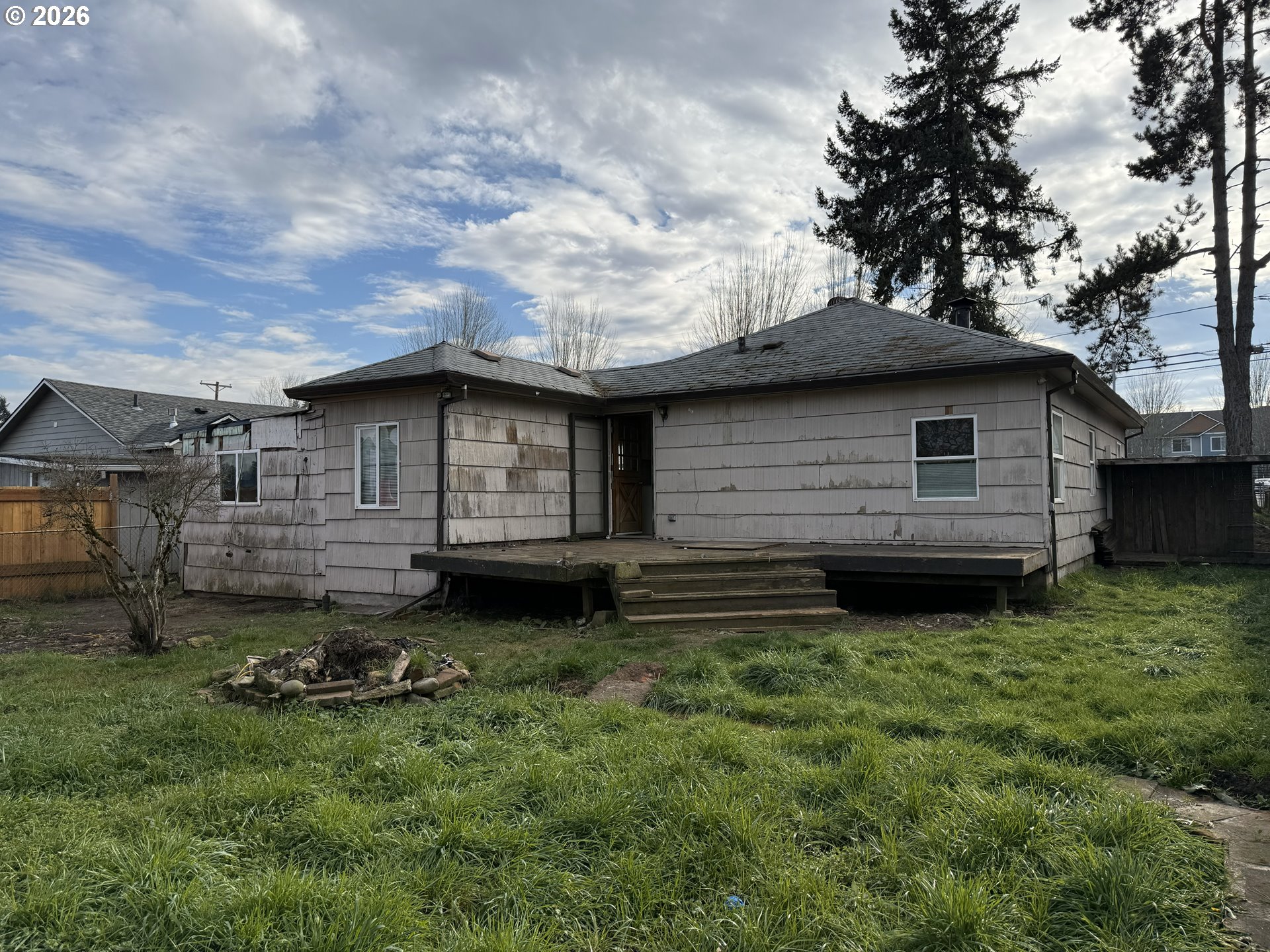 7451 Southeast Johnson Street Hillsboro, OR 97123 - Photo 21 of 27 a backyard of a house with barbeque oven and table