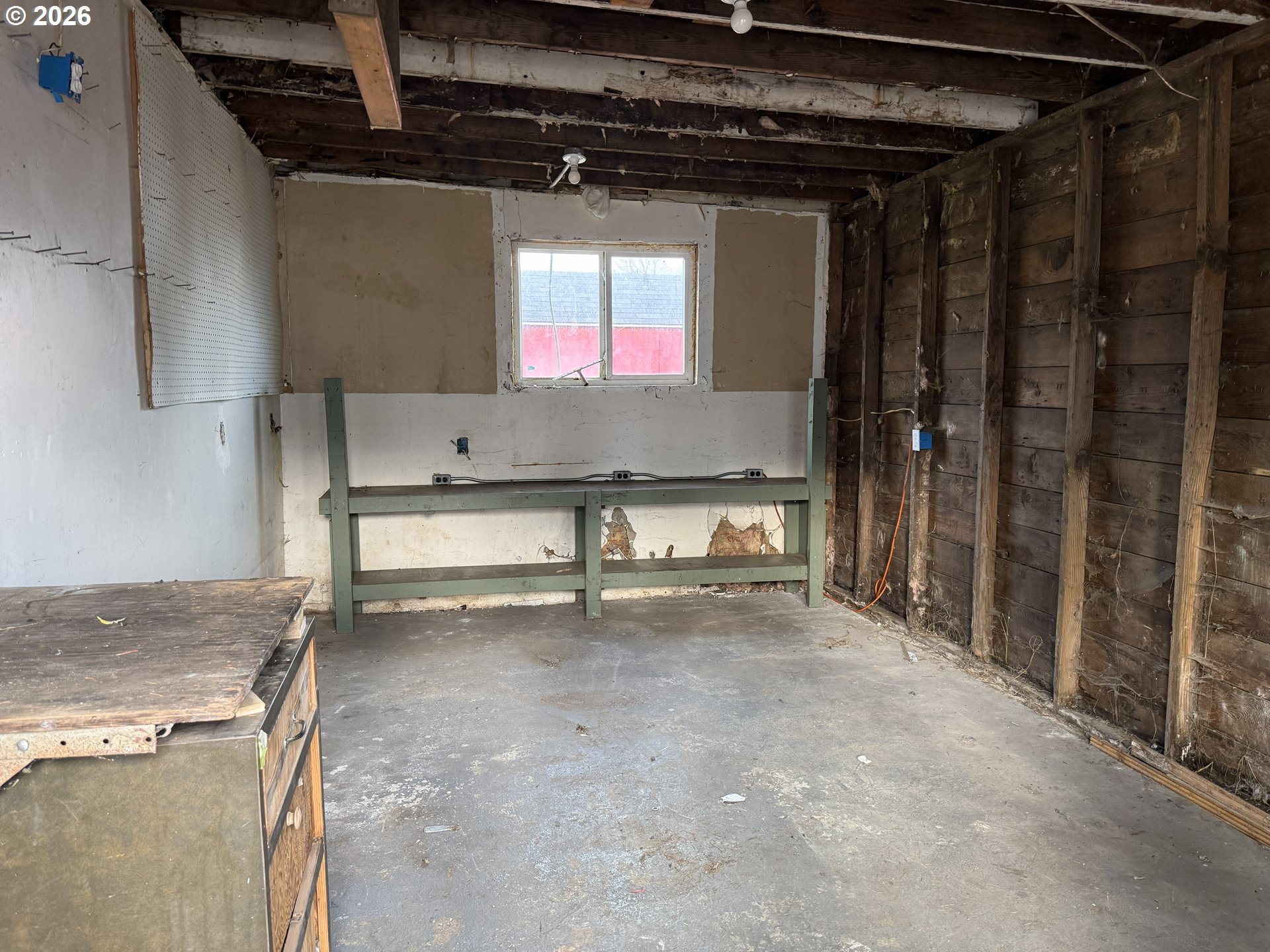 7451 Southeast Johnson Street Hillsboro, OR 97123 - Photo 25 of 27 a view of a room with a fireplace and a chandelier