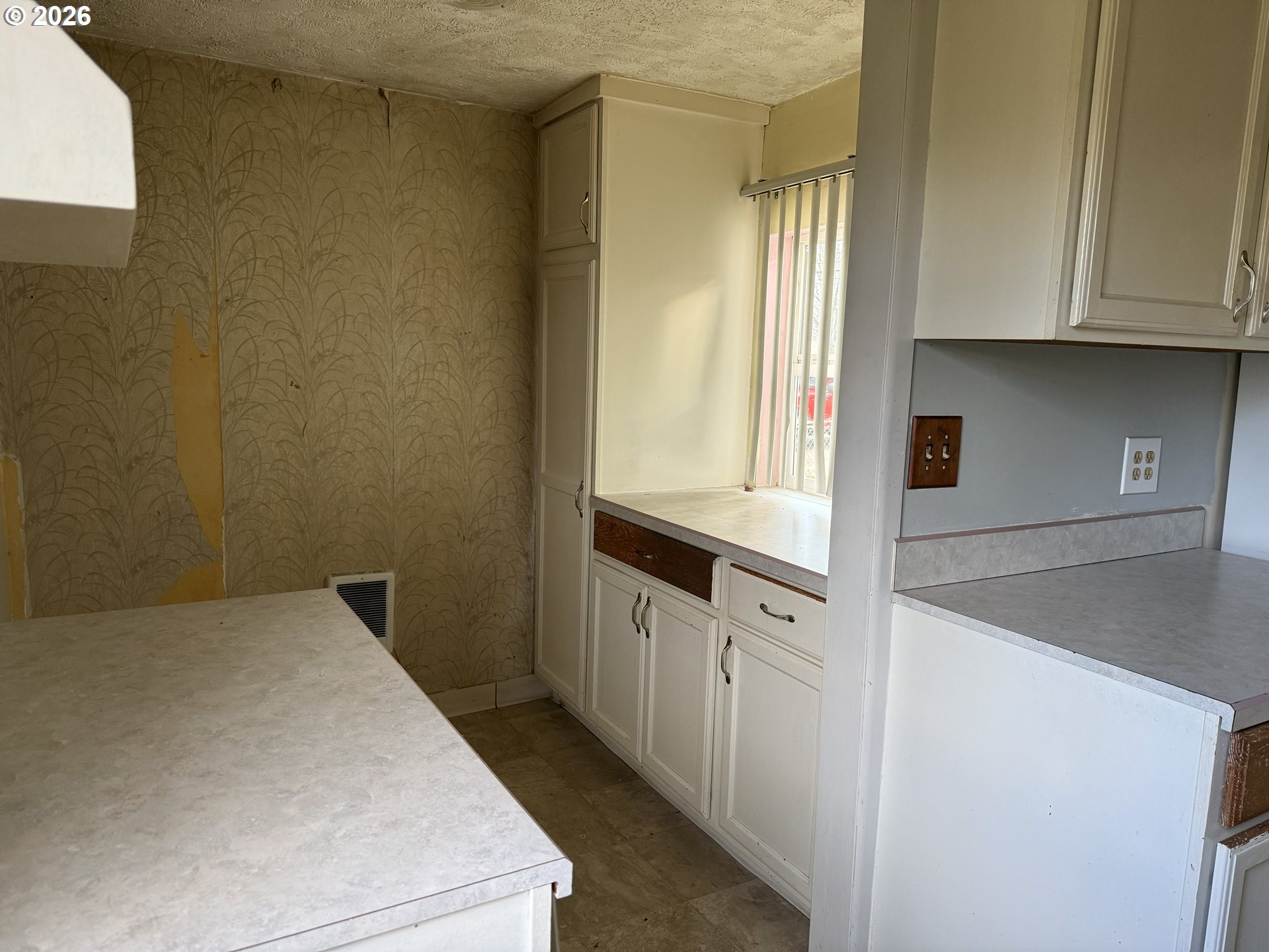 7451 Southeast Johnson Street Hillsboro, OR 97123 - Photo 10 of 27 a kitchen with granite countertop white cabinets and white appliances