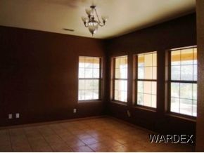 7945 South Hawk Road Kingman, AZ 86401 - Photo 12 of 24 a view of an empty room with a window