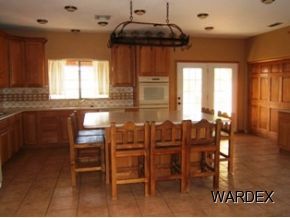 7945 South Hawk Road Kingman, AZ 86401 - Photo 5 of 24 a dining room with furniture window and wooden floor