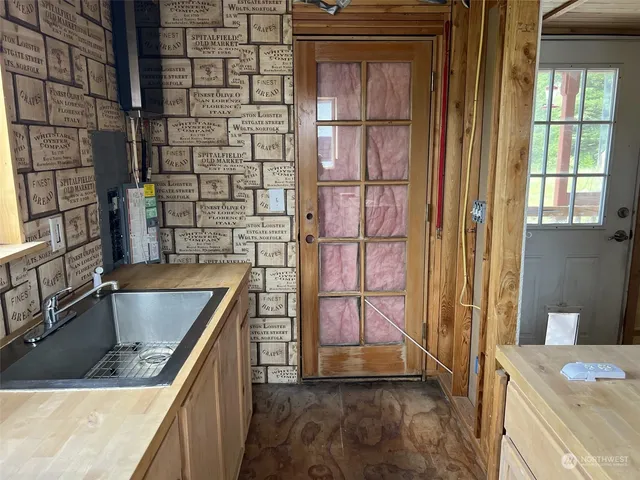 a room with furniture a rug and a window