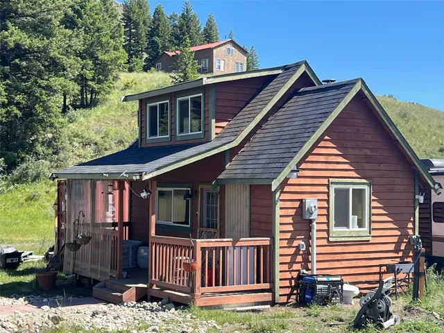 a view of house with backyard space and garden