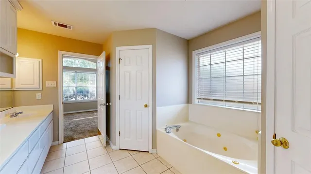 a bathroom with a bathtub toilet and sink