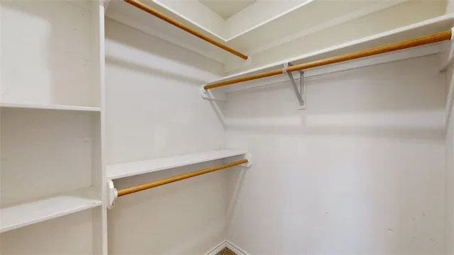 a view of hallway with wooden floor