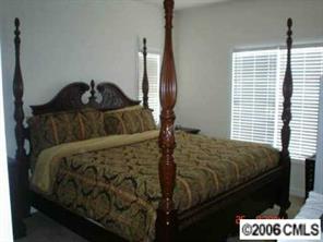 152 Singleton Road Mooresville, NC 28117 - Photo 5 of 6 a bedroom with a bed and a window