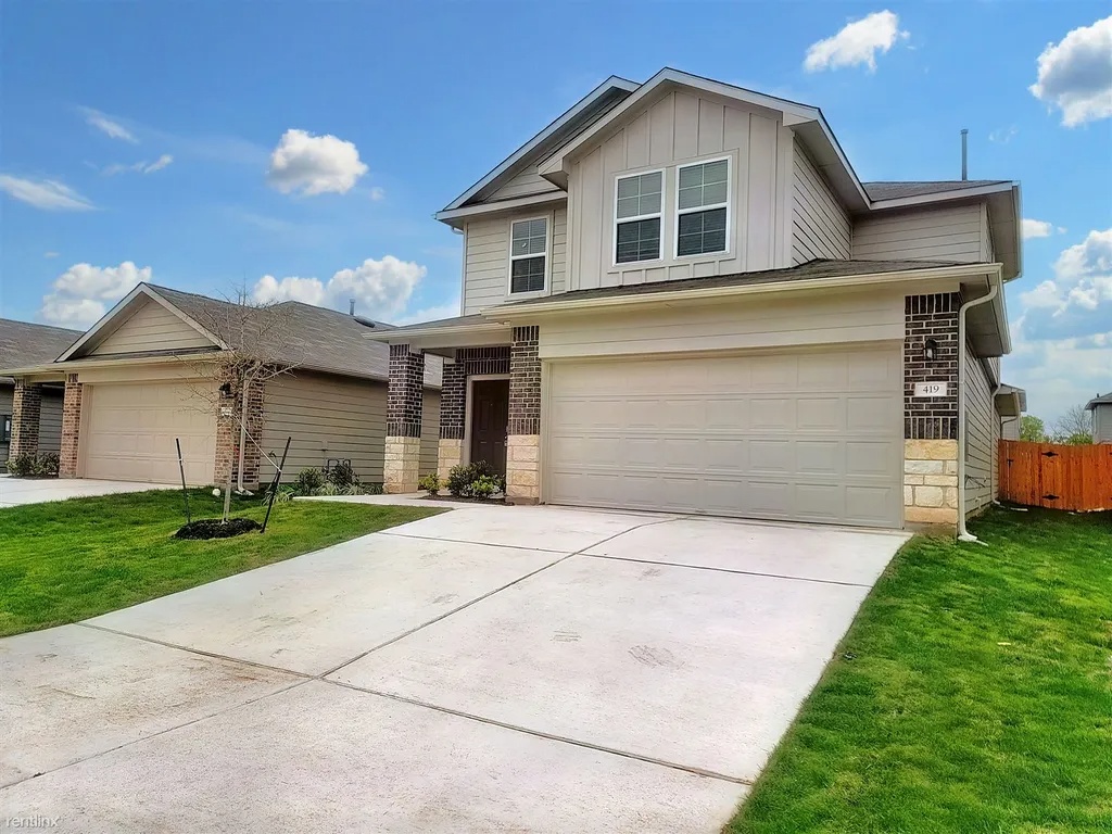 419 Sickle Loop Kyle, TX 78640 - Photo 3 of 35 A contemporary residence with a broad driveway and a neatly kept front yard beckons you home.