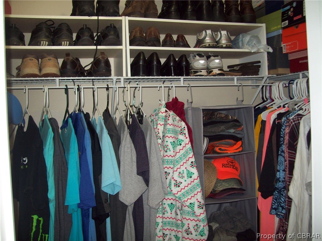 133 Dixon Road Hudgins, VA 23076 - Photo 16 of 25 a view of walk in closet with clothes and shoes