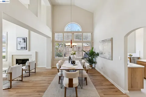 a view of a dining room with furniture and window