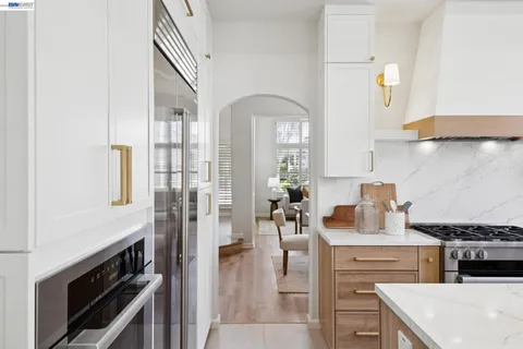 a living room with a fireplace and a flat screen tv