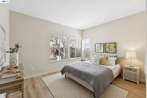 a bed room with a bed and a window