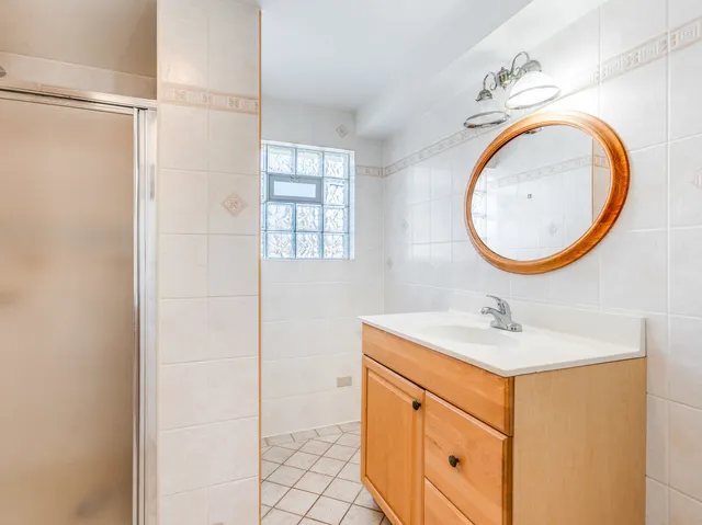 a bathroom with a sink a vanity and a mirror