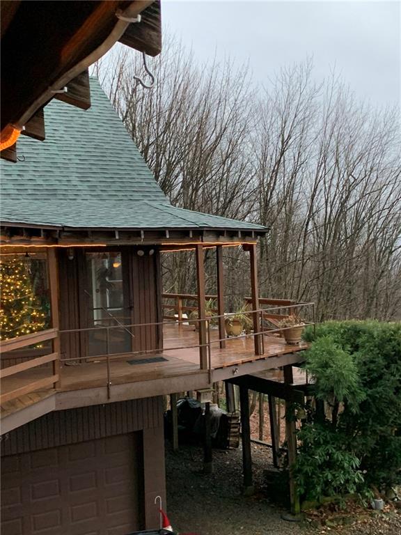 235 Pine Knob Road Hopwood, PA 15445 - Photo 15 of 39 a backyard of a house with barbeque oven table and chairs