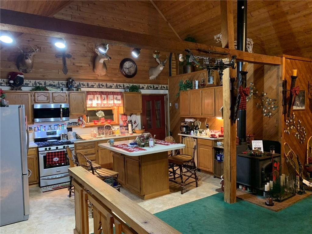 235 Pine Knob Road Hopwood, PA 15445 - Photo 17 of 39 a view of a kitchen with a table and chairs