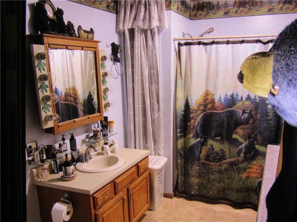 235 Pine Knob Road Hopwood, PA 15445 - Photo 24 of 39 a bathroom with a sink vanity and a mirror