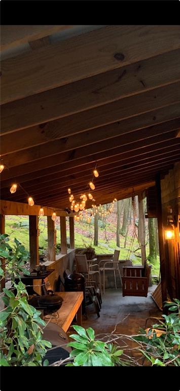 235 Pine Knob Road Hopwood, PA 15445 - Photo 30 of 39 a view of a patio with table and chairs potted plants and floor to ceiling window