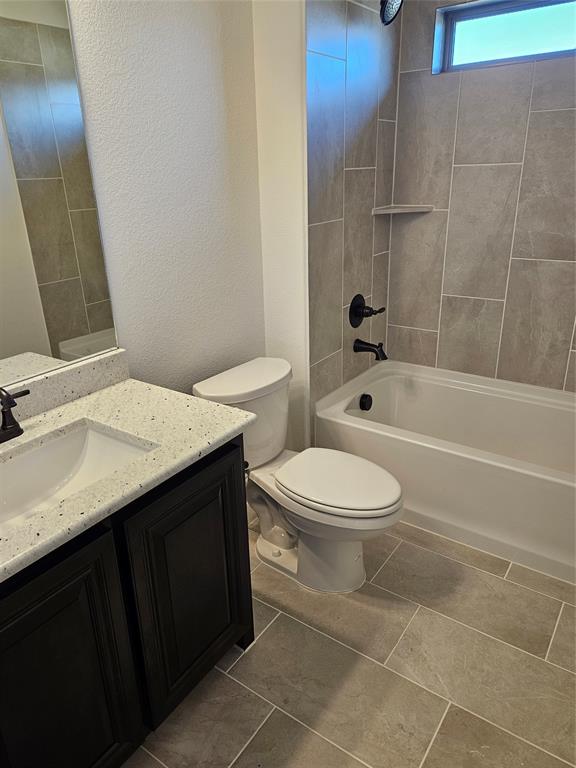 1507 Enloe Road Howe, TX 75459 - Photo 11 of 27 a bathroom with a sink a toilet and shower