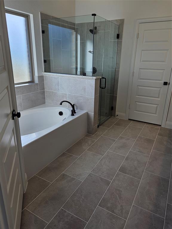 1507 Enloe Road Howe, TX 75459 - Photo 15 of 27 a bathroom with a bathtub and a shower
