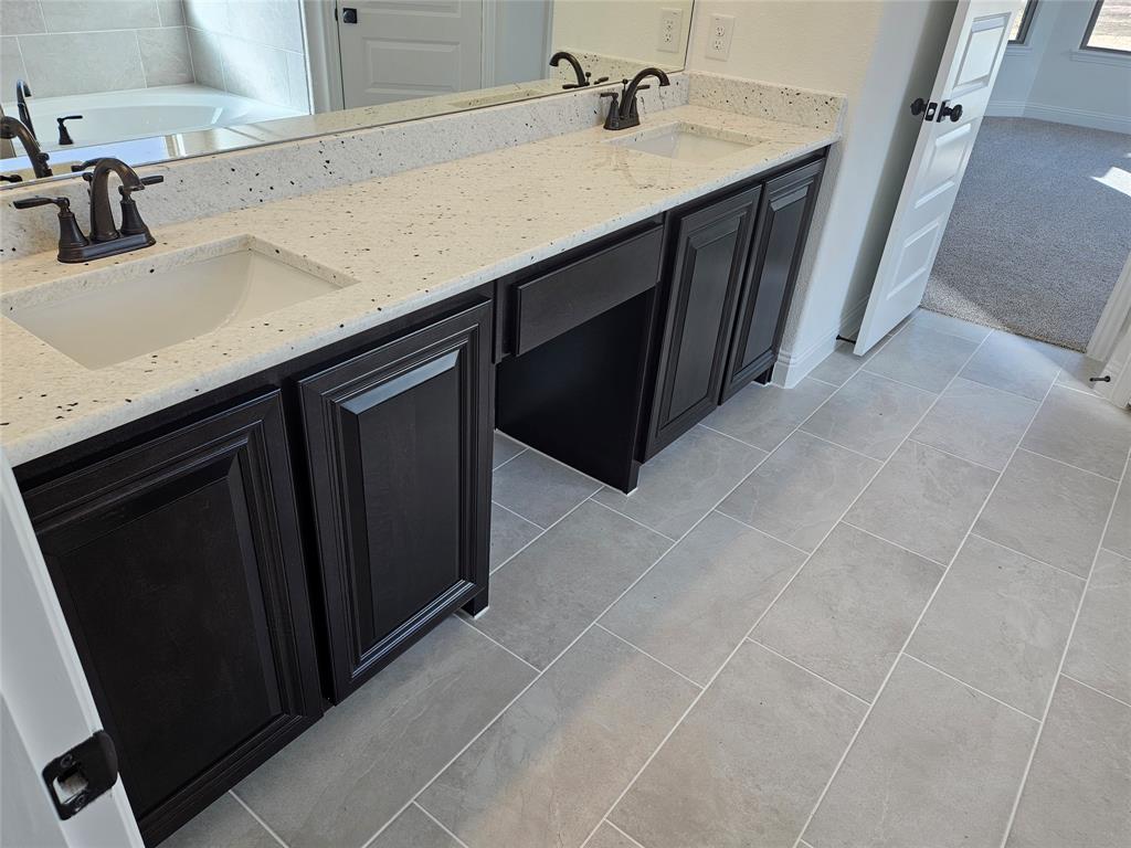 1507 Enloe Road Howe, TX 75459 - Photo 18 of 27 a kitchen with a sink and cabinets