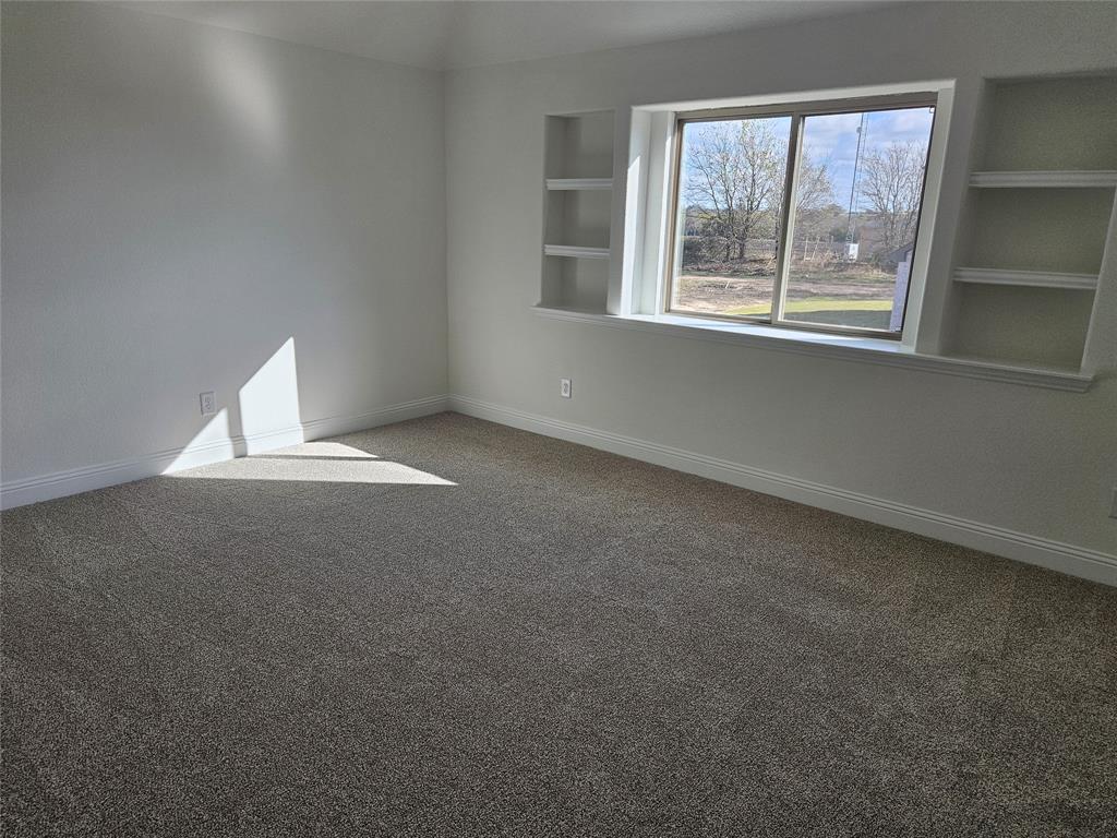 1507 Enloe Road Howe, TX 75459 - Photo 22 of 27 a view of an empty room with a window