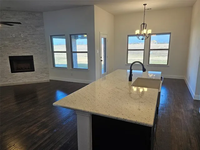 a dining table with chairs and wooden floor