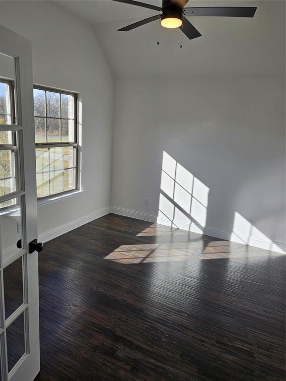 1507 Enloe Road Howe, TX 75459 - Photo 10 of 27 an empty room with wooden floor and windows