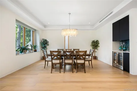 a view of a dining room with furniture window and outside view